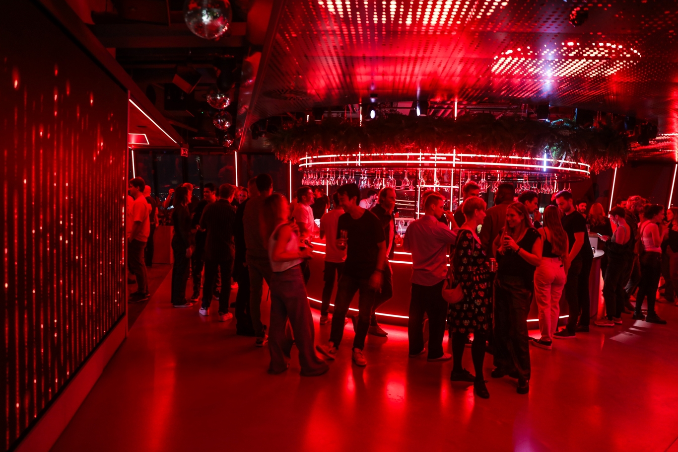 People in the breakout space socalising after a social.